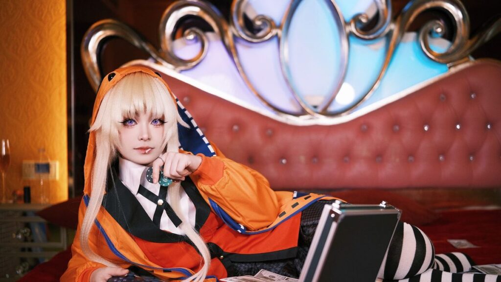 Cosplayer in vibrant outfit lounging on bed with game controller and cash, creating a playful scene.