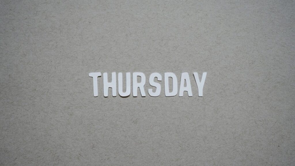 the word thursday cut out of paper